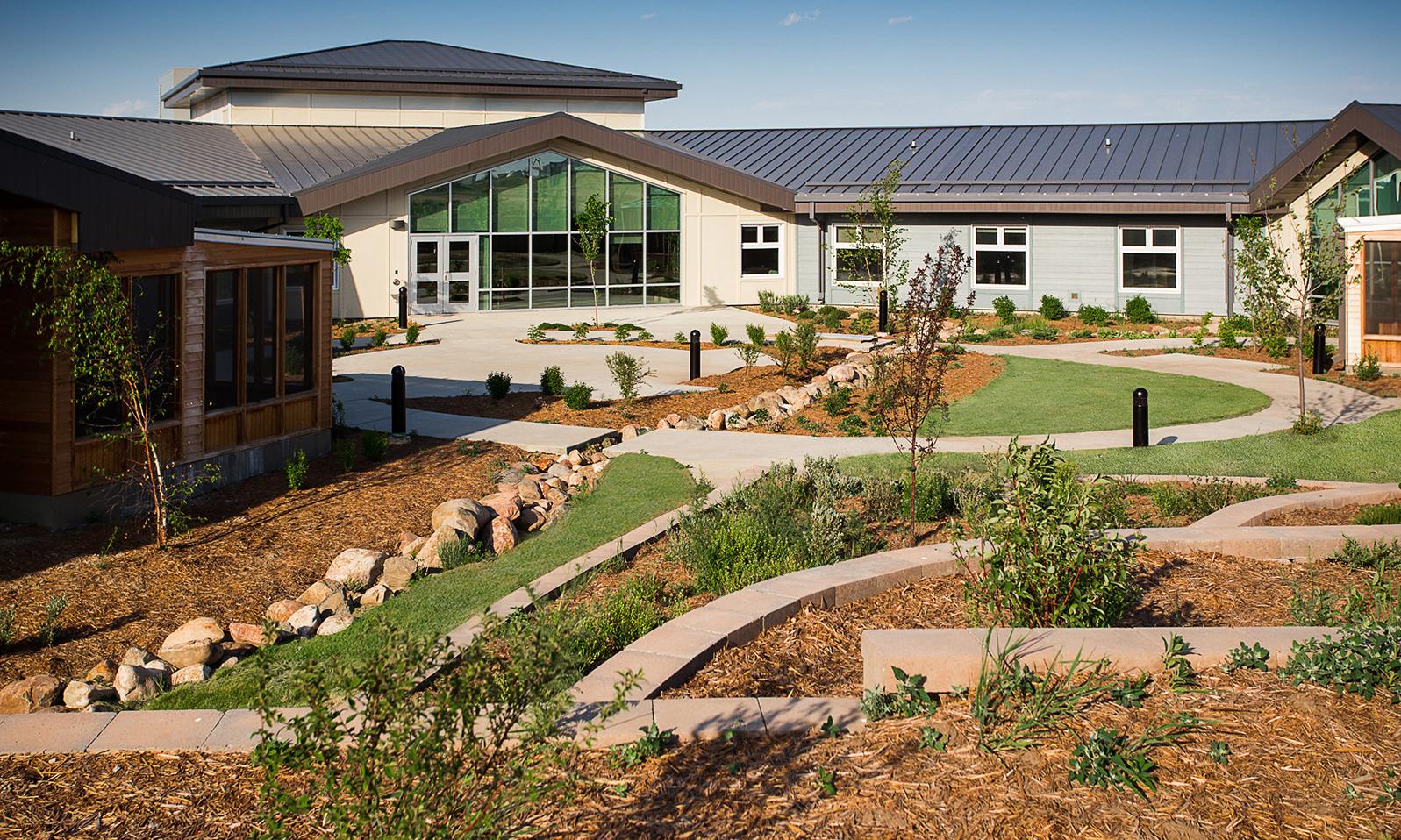 Kerrobert Integrated Health Centre. Backyard of facility with tiered lawn and gardens.