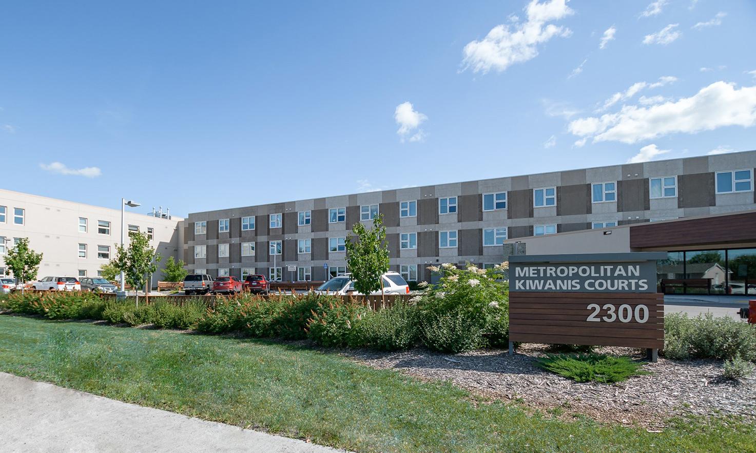 The exterior of the building from the street in summer.