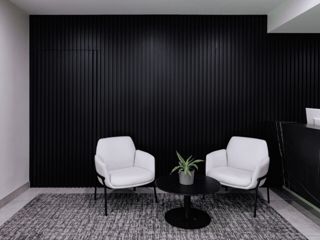 Two chairs in front of a nondescript door