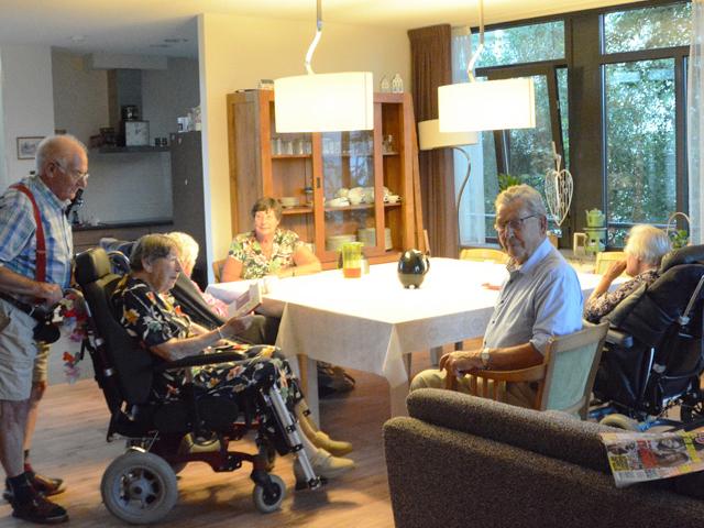 Household Model of Seniors Care. Seniors having supper in a family-style environment.