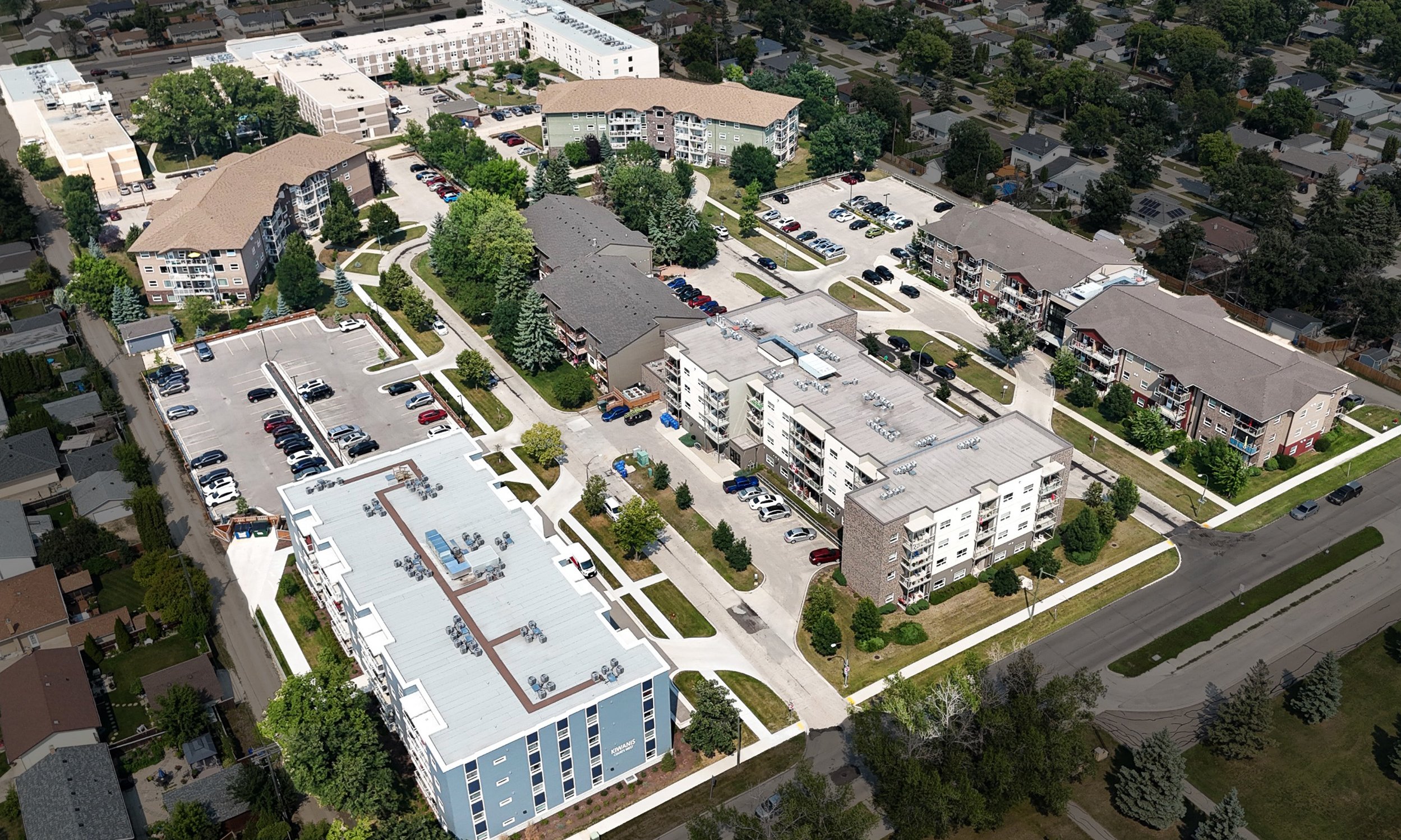 Aerial image of five buildings in a campus like setting