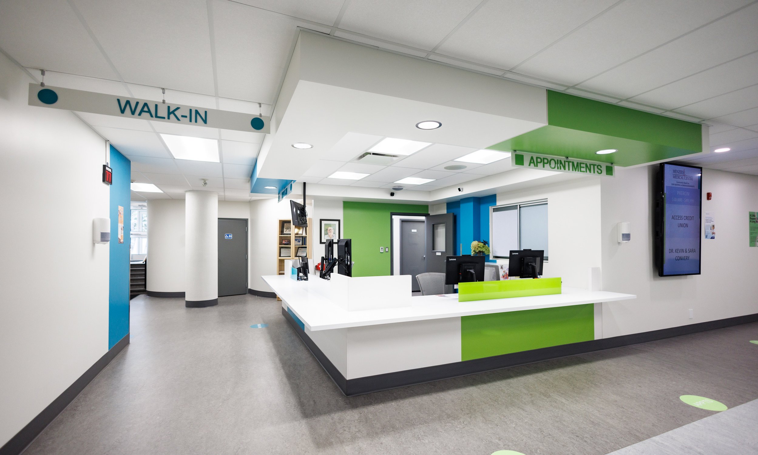 Green and white clinic with a modern reception desk