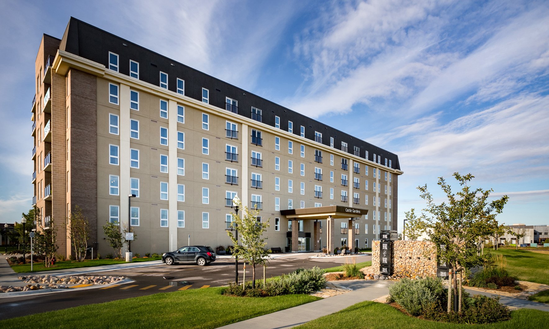 Castle-inspired residential building against a clear blue sky