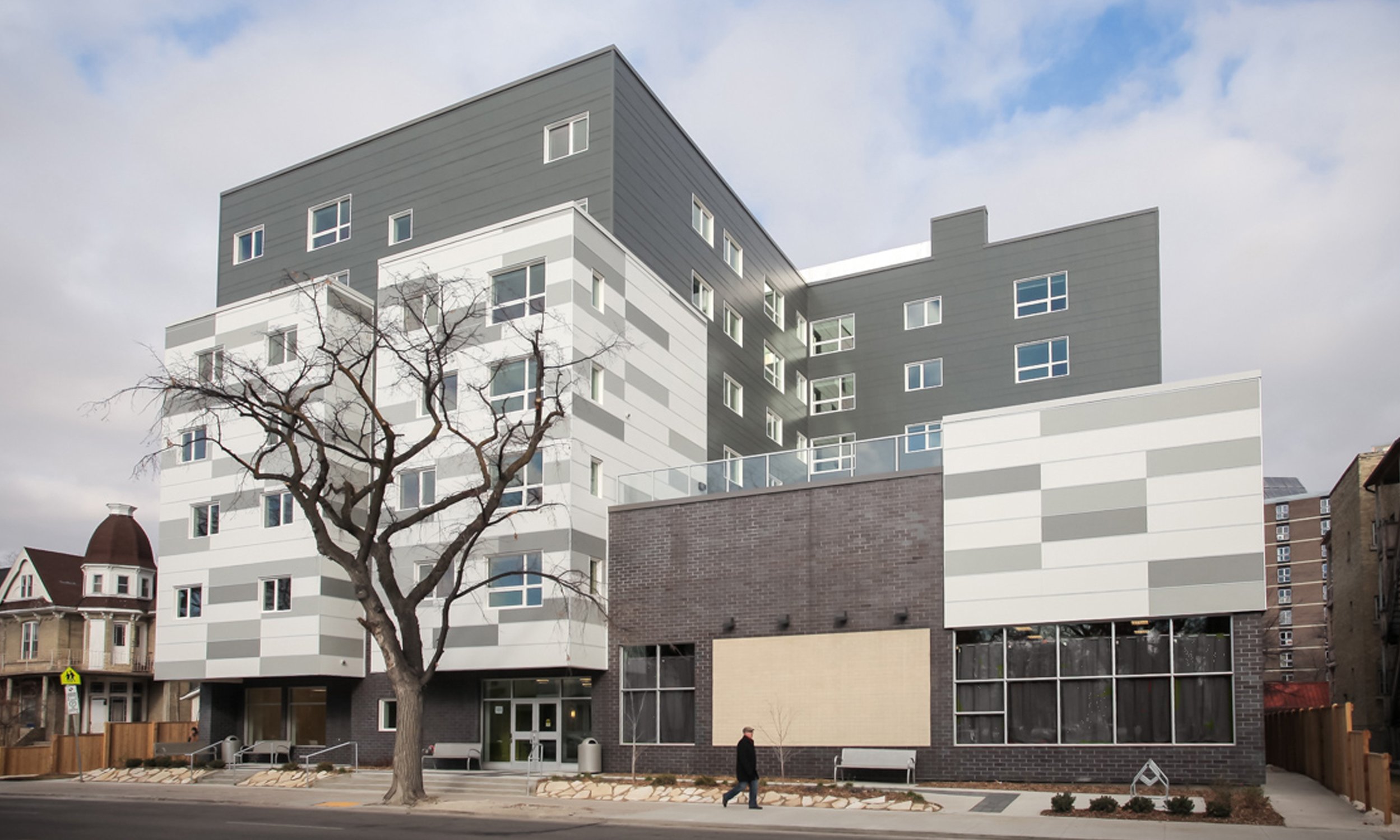 White and grey mid-rise with rooftop terrace